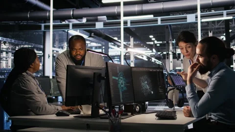 Programmers doing brainstorming in server room, reviewing AI code Stock Footage 309787841
