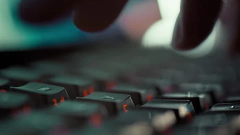 A programmers fingers swiftly tap keyboard keys in an extreme close-up craft Video stock 331475333