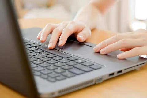 Programmer's hand typing with laptop. focus on his finger Foto stock