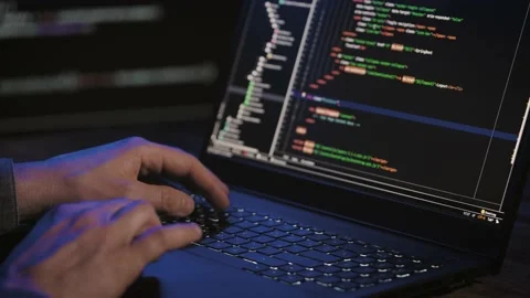 Programmer's hands and laptop keyboard close-up. Working on a project on a Stock Footage 173040696
