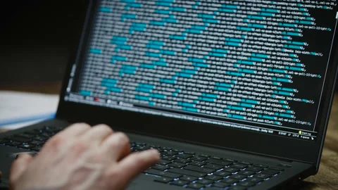 Programmer's hands and laptop keyboard close-up. Working on a project on a Видео 173042455