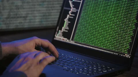 Programmer's hands and laptop keyboard close-up. Working on a project on a Stock Footage 174863417