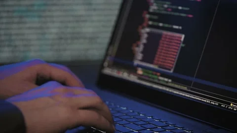 Programmer's hands and laptop keyboard close-up. Working on a project on a Stock Footage 177311333
