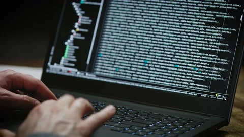 Programmer's hands and laptop keyboard close-up. The developer writes the Stock Footage 180023106