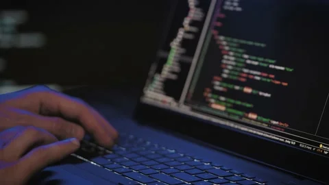 Programmer's hands and laptop keyboard close-up. Working on a project on a Stock Footage 182291400