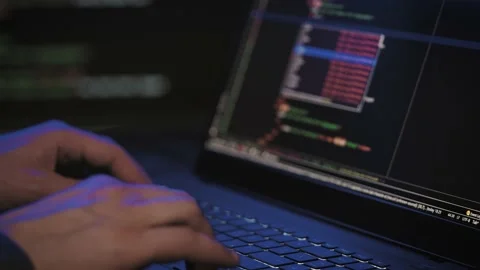 Programmer's hands and laptop keyboard close-up. Working on a project on a Stock Footage 183246331
