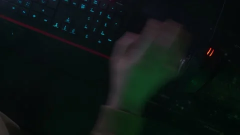 The programmer's hands click on the mouse, quickly type on the keyboard, coding Stock Footage 147605555