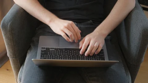A programmer's hands coding on a laptop, fast touch typing on the keyboard Stock Footage 315290123