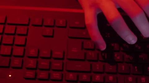The programmer's hands quickly type on the keyboard, coding, programming, gaming Stock Footage 147668975