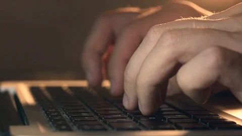 Programmer's hands typing code on a laptop's keypad Stockbeeldmateriaal 80675395