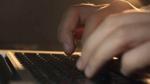 Programmer's hands typing code on a laptop's keypad Video stock 80675409