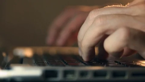 Programmer's hands typing code on a laptop's keypad Video stock 80675431