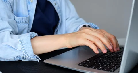 Programmers hands typing intensely on laptop keyboard, pausing briefly for Video stock 316757660
