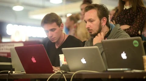 Programmers In Headphones Sitting At The Computers Stock Footage 56730790