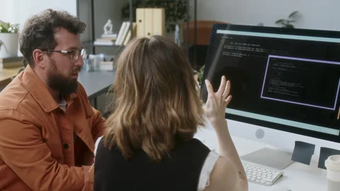 Programmers Helping Each Other Stock Footage 313493558