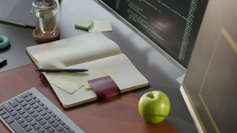 Programmers Office Desk with Running Program Code on PC Screen Stock Footage 306837455