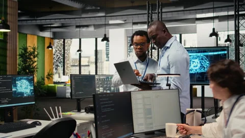 Programmers in office doing software development, brainstorming Stock Footage 322704637