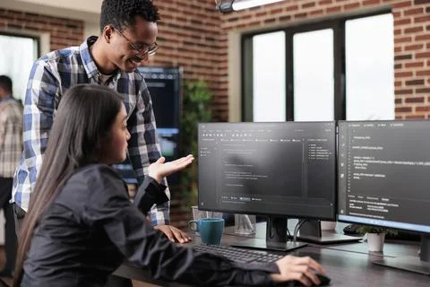 Programmers questioning source of cyber attacks and system security coverage Stock Photos