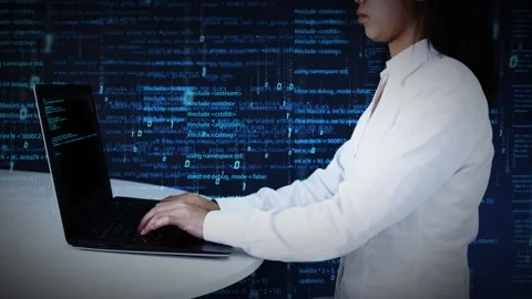 Programmers type code with computers Stock Footage 166681414