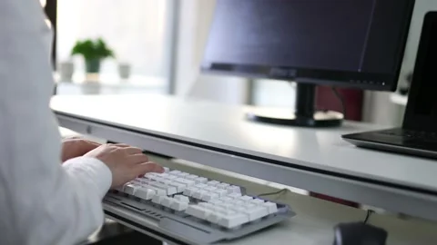 Programmers type with keyboards Stock Footage 168966431