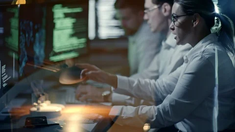 Programmers Typing on Computers at Night 動画素材 85826993