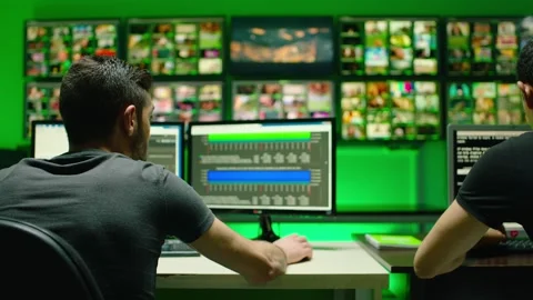 Programmers using many laptops , computers , following information, statistics . Stock Footage 163552580