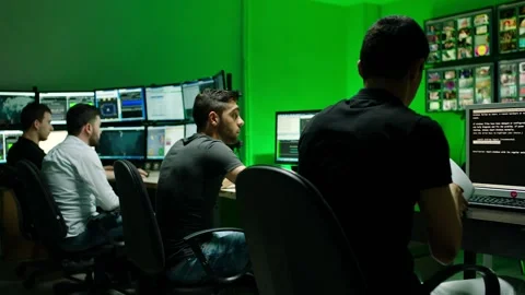 Programmers using many laptops , computers , following information, statistics . Stock Footage 163552640