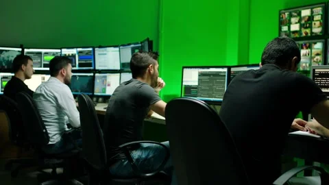 Programmers using many laptops , computers , following information, statistics . Stock Footage 163552962