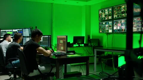 Programmers using many laptops , computers , following information, statistics . Stock Footage 163553994