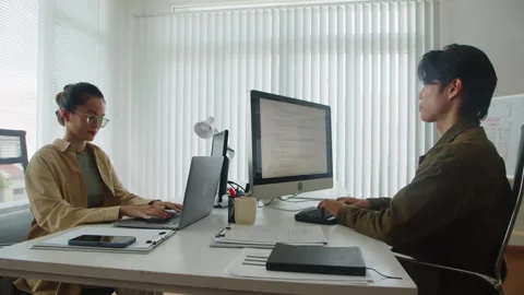 Programmers Working on Codes during Software Developing in Office Stock Footage 256978182