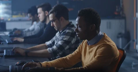 Programmers working in a common office Stock Footage 125170751