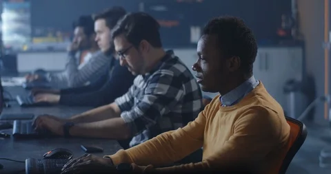 Programmers working in a common office Stock Footage 125171897