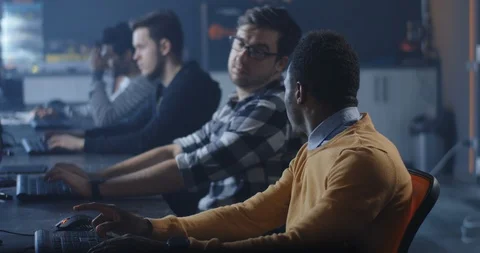 Programmers working in a common office Stock Footage 125173880