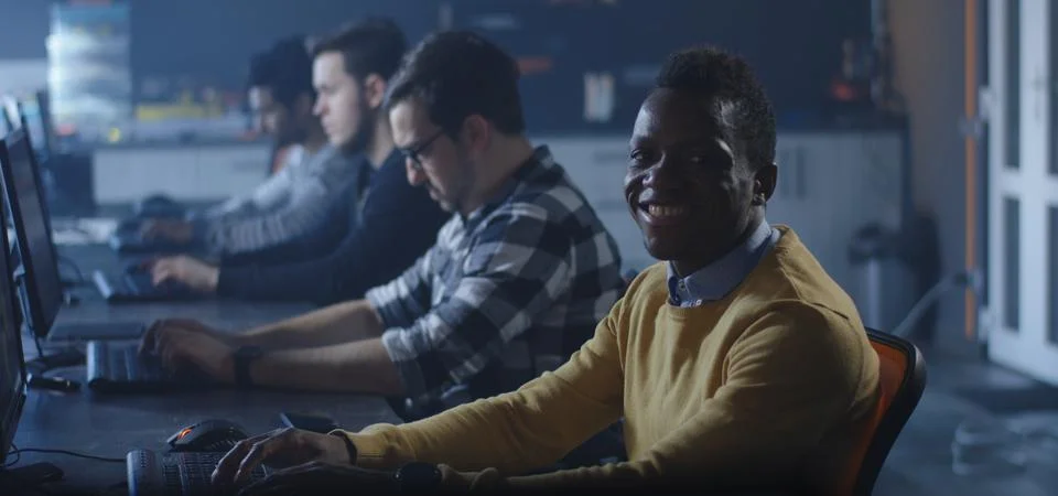 Programmers working in a common office Stock Photos