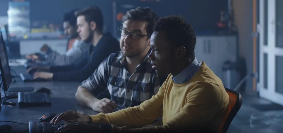 Programmers working in a common office 스톡 사진