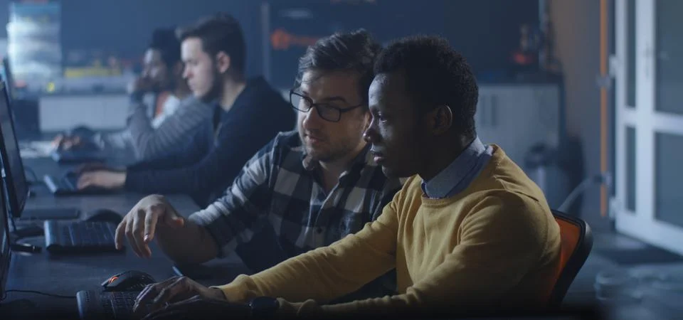 Programmers working in a common office Stock-Fotos