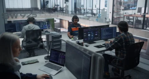 Programmers Working in Glass Office Stock Footage 296183563
