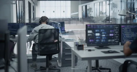 Programmers Working in Glass Office Stock Footage 296184178