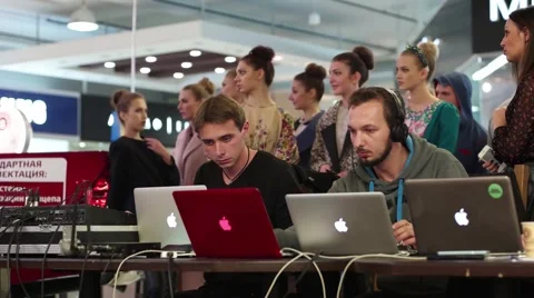 Programmers working on multiple laptops on the forum program makers Stock Footage 57175451