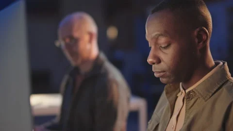 Programmers Working in Office at Night Stock Footage 164918113