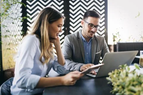 Programmers working in a software developing company office Stock Photos