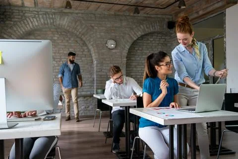 Programmers working in a software developing company office. Business people as Stock Photos