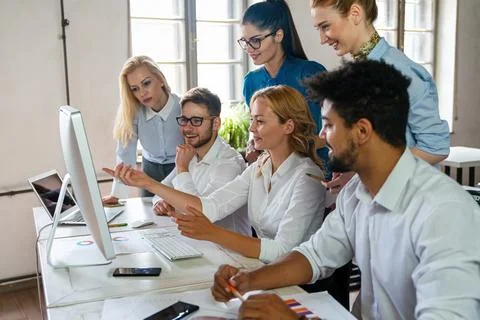 Programmers working in a software developing company office. Business people as Stock Photos
