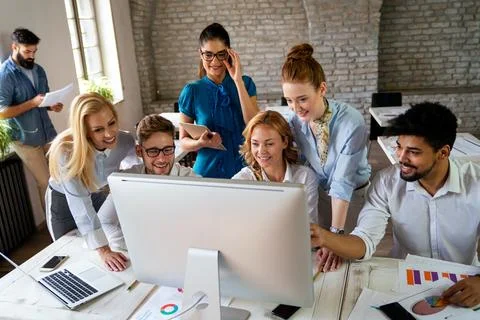 Programmers working in a software developing company office. Business peopl.. Stock Photos