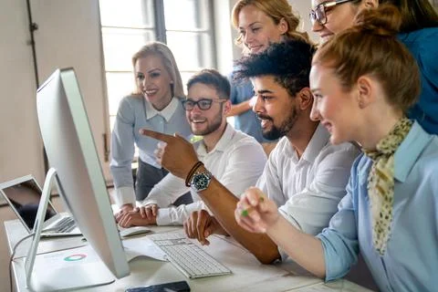 Programmers working in a software developing company office. Business peopl.. Stock Photos