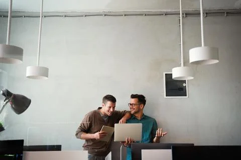 Programmers working in a software developing company office Stock Photos