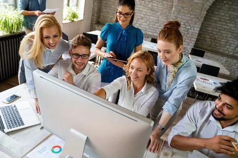 Programmers working in a software developing company office. Business peopl.. Stock Photos