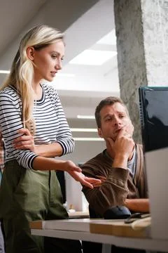Programmers working in a software developing company office Stock Photos