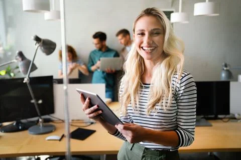 Programmers working in a software developing company office Stock Photos