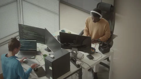 Programmers Working Together at Desk in Open Space Office Stock-Footage 263727385